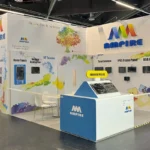 Ampire's booth at Embedded World 2025 in Nuremberg, showcasing cutting-edge industrial display technologies and embedded solutions. The booth is attractively designed and buzzing with visitors, reflecting the high level of interest in their innovative products. Key highlights include interactive demonstrations, product prototypes, and a welcoming team ready to discuss advanced solutions tailored to industry needs. The vibrant atmosphere emphasizes Ampire's role as a leader in the embedded technology sector.